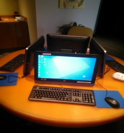 Computer on round orange desk